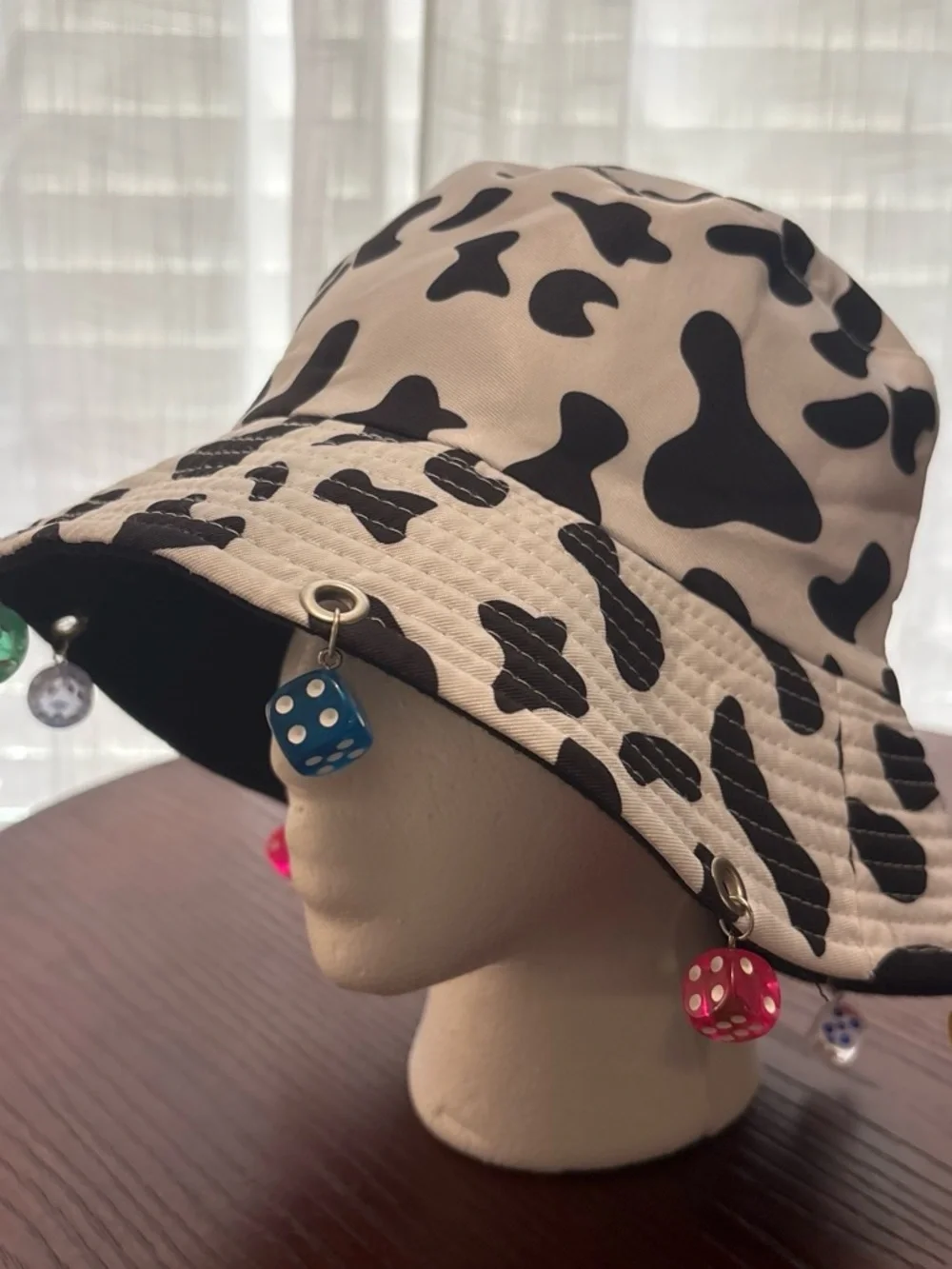 Black & White Cow Print Bucket Hat with Colorful Dice Charms